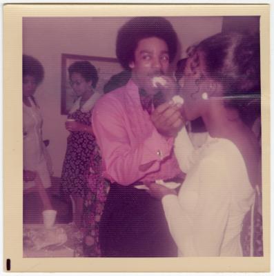 Terry Edgerton and her husband feeding each other cake