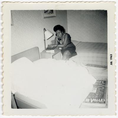 Fannie Wilson talking on a hotel phone