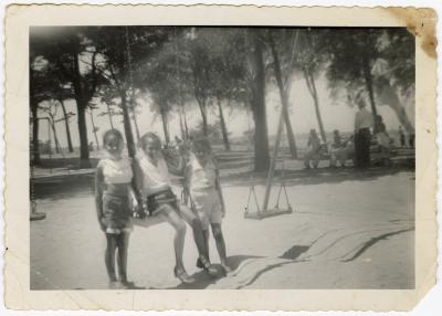 Girls on the park swing set 