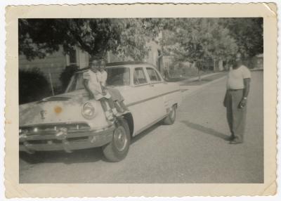 Girls sitting on a car