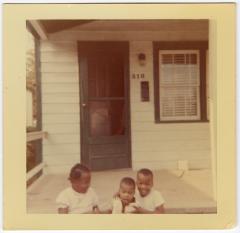 Deaton children sitting on the front steps
