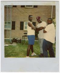 Polaroid of three men