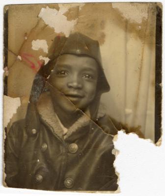 Child wearing an aviator jacket and hat