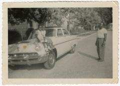 Girls sitting on a car