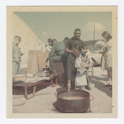 Dishing up beans at the Annual VITA Foods Cookout 