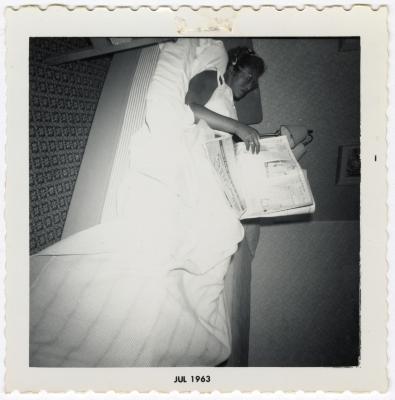 Thelma Wilson reading a newspaper