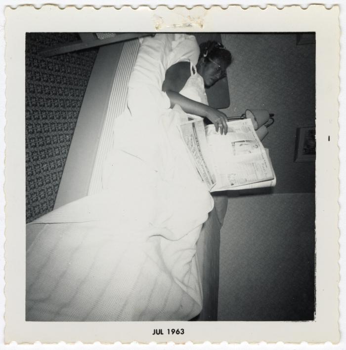 Thelma Wilson reading a newspaper