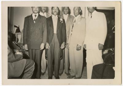 James Manuel posing with wedding guests