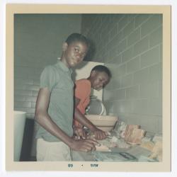 Edward "Woodie" Rowe and Marvin Rowe making sandwiches