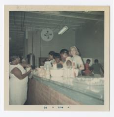Mrs. D. Tasch, Donna Thompson, Sharon Elias, Renae Cann and Vanessa Lomax visit the food counter at Vita Foods