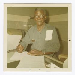 Richard Henry Ford completing VITA Foods paperwork just before his retirement from the plant, 1970