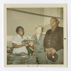 Handing out VITA Foods uniforms