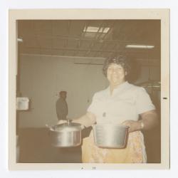 Carrie Wilson preparing Christmas dinner at Vita Foods, 12-3-1971