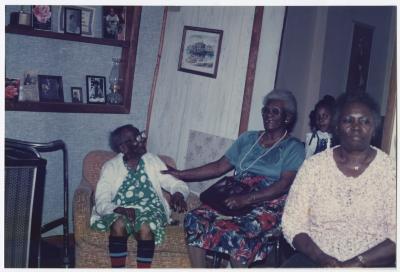 Cora Walker laughing with her daughter and granddaughter 