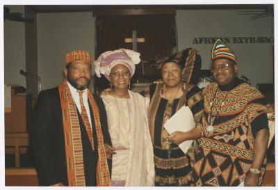 Four people in traditional African clothing