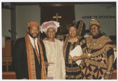 Four people in traditional African clothing