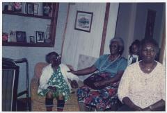 Cora Walker laughing with her daughter and granddaughter 