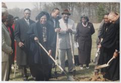 Five people breaking ground
