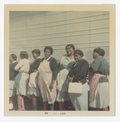 Mary Smith, Elaine Hopkins, Flora "Babe" Goldsboro, Rosie Goldsboro, Mae Ashe, Viola Massey "Aunt Sis", and an unknown woman pose in front of a VITA Food truck.