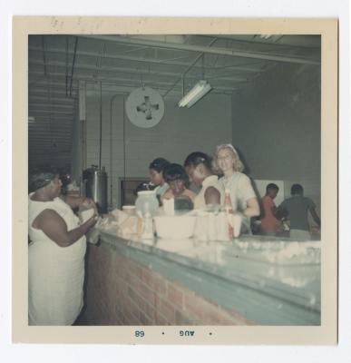 Mrs. D. Tasch, Donna Thompson, Sharon Elias, Renae Cann and Vanessa Lomax visit the food counter at Vita Foods