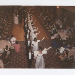 Debutantes exiting with escorts from the ballroom floor