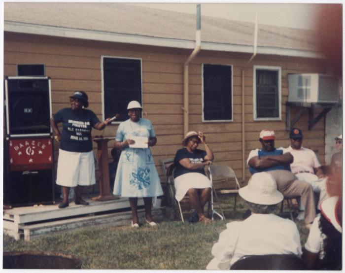 Woman speaking at a microphone