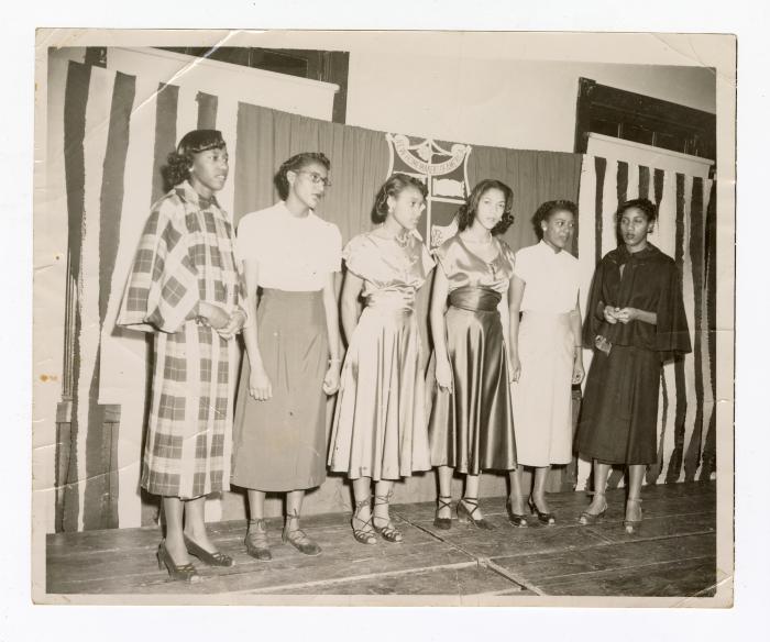 Six formally dressed women