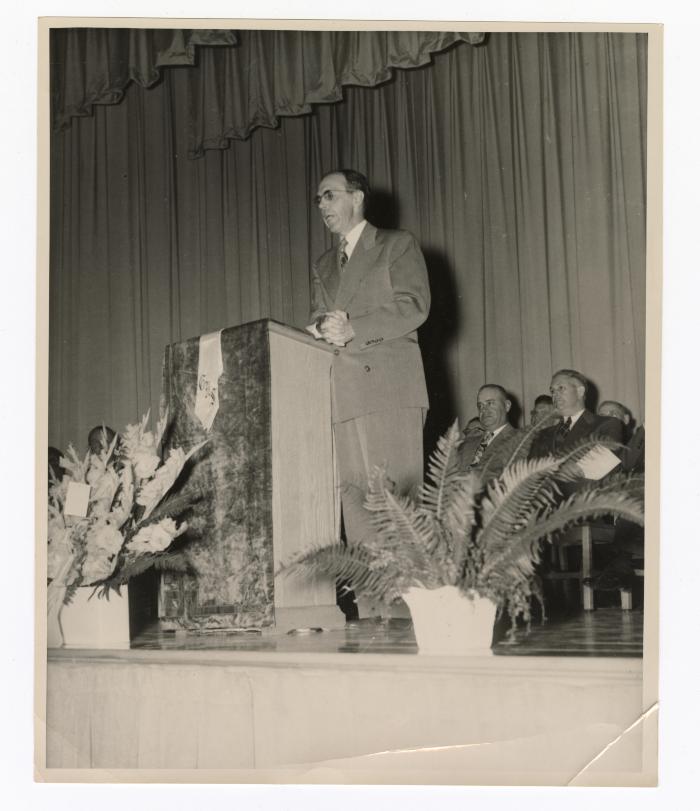 Delivering a speech at a podium