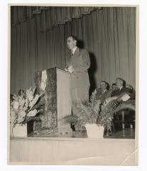 Delivering a speech at a podium