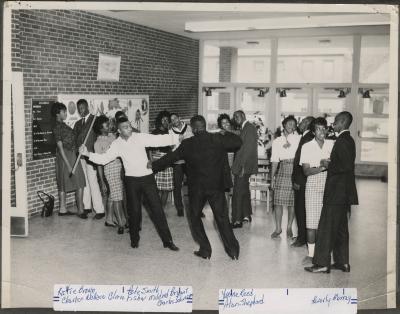 Group of teenagers in a school hallway
