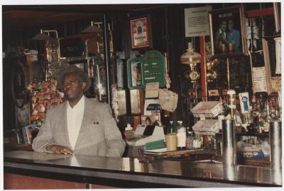 Charlie Graves behind bar at Uptown Club, prior to demolition day 1988