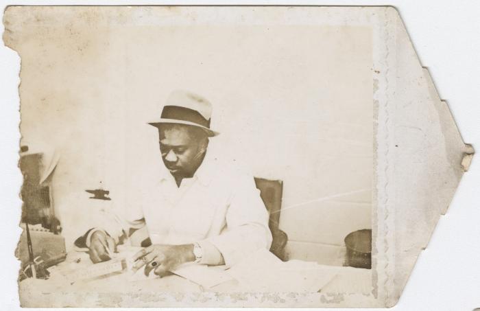 Charlie Graves in office of Uptown Club, circa 1954