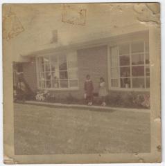 Monica and Karen, Daughters of Charlie and Hilda Graves, Outside Their New Home, circa 1965
