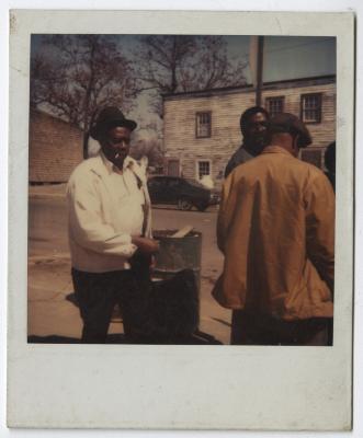 Charlie Graves outside his Uptown Club with "regulars" James Jackson and Morris Goldsborough, circa 1988
