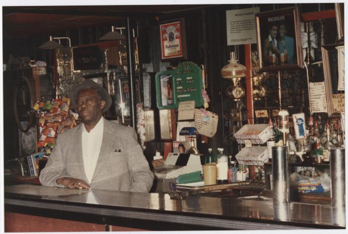 Charlie Graves behind bar at Uptown Club, prior to demolition day 1988