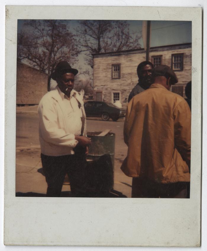 Charlie Graves outside his Uptown Club with "regulars" James Jackson and Morris Goldsborough, circa 1988