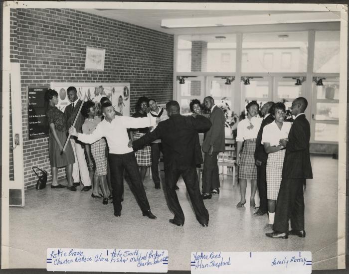 Group of teenagers in a school hallway