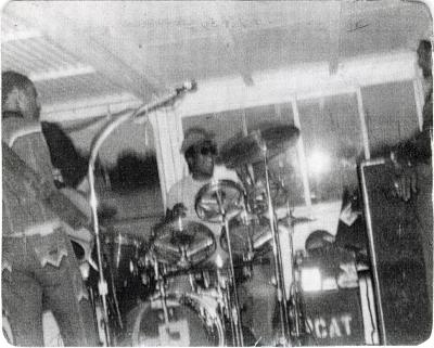 Photograph of Corey "Fat Cat" Hackett drummer and others in 1980
