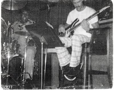Photograph of Corey "Fat Cat" Hackett at drum with guitarist, 1977