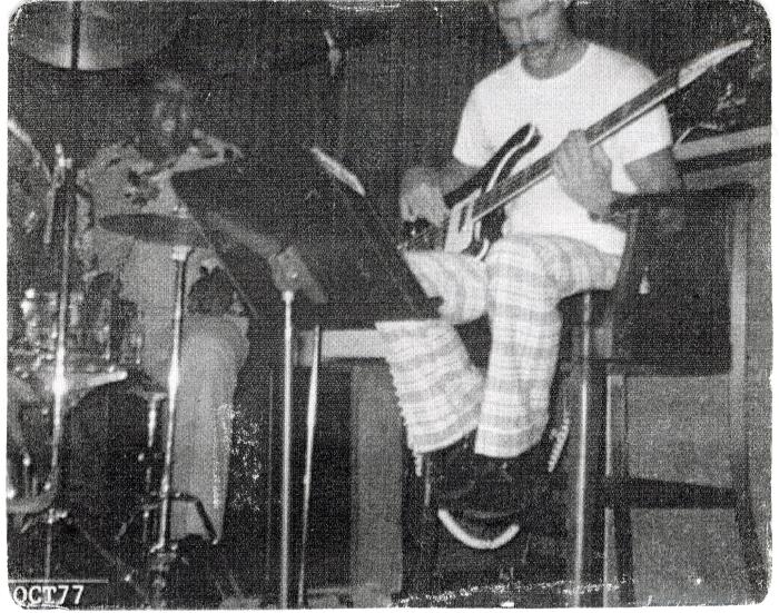 Photograph of Corey "Fat Cat" Hackett at drum with guitarist, 1977
