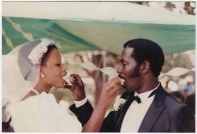 The Johnsons - husband and wife share their wedding cake. 