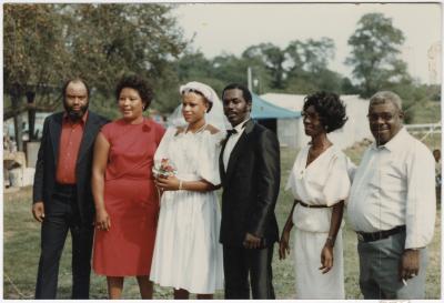 Deborah and Barry Jones with parents on wedding day on the Jones Farm, 1983