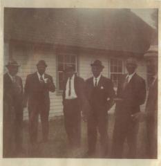 Photograph of six well-dressed men