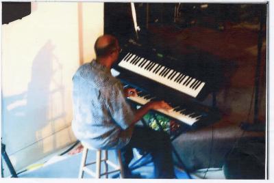 Photograph of Wilford "Money" Rochester playing the keyboard