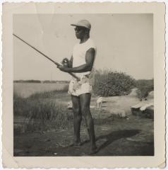 Man Sitting on Pier