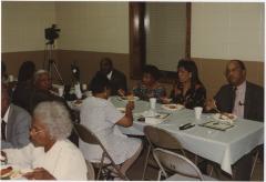 LaMonte Cooke with a Group Enjoying a Meal at a Religious Gathering
