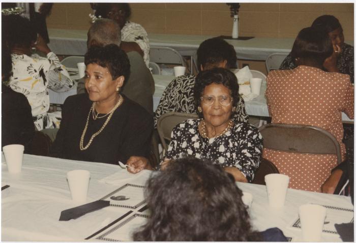 Two Women Attending a Religious Event