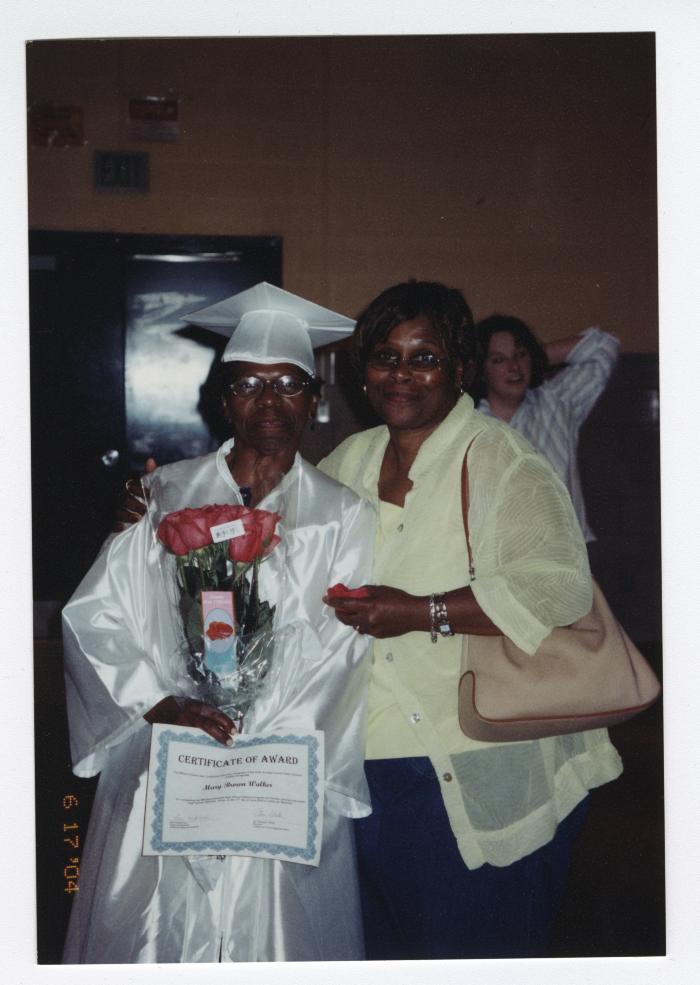 Mary Walker at her high school graduation with friend Faye Little