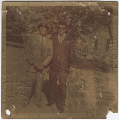 Worn Photo of Two Men in Suits
