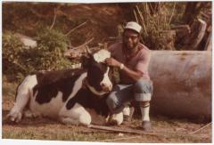 Marvin Jones Posing with a Small Cow 